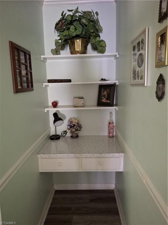 room details featuring wood-type flooring and ornamental molding