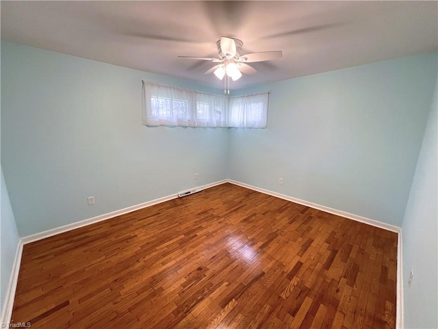 spare room featuring ceiling fan and hardwood / wood-style floors