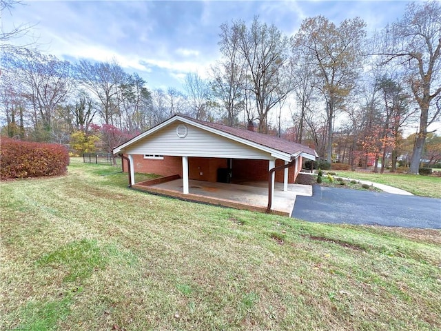 view of side of home featuring a lawn