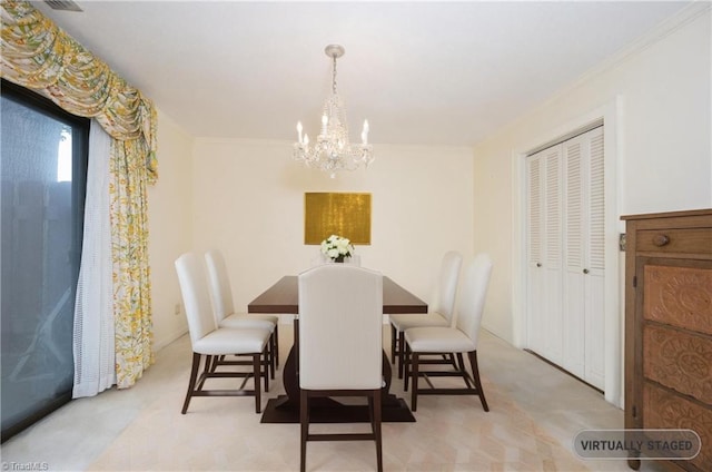 dining space with an inviting chandelier, ornamental molding, and carpet