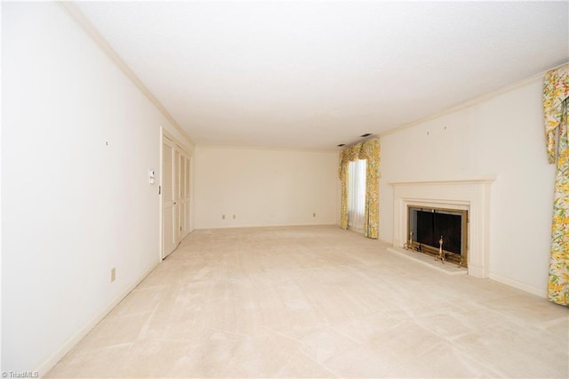 unfurnished living room with a fireplace with raised hearth and light carpet