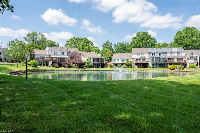 view of yard featuring a water view and a residential view