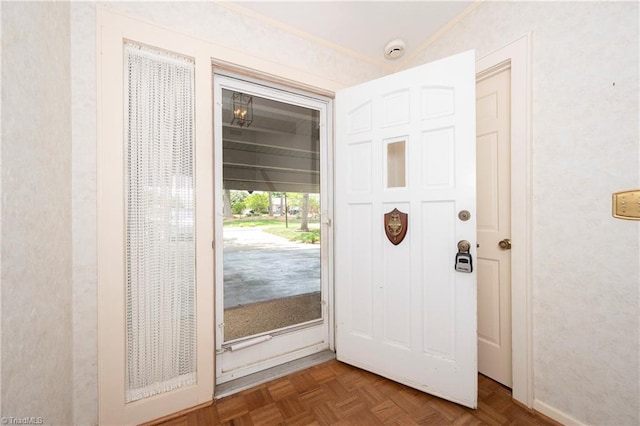 foyer featuring ornamental molding