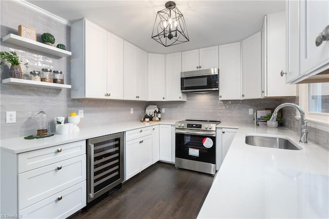 4105 Oak Hollow Dr, High Point, NC 27265 - kitchen featuring beverage cooler, appliances with stainless steel finishes, decorative backsplash, and light countertops