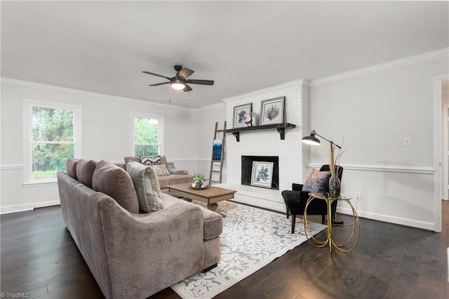 4105 Oak Hollow Dr, High Point, NC 27265 - living room featuring dark wood-style floors, crown molding, ceiling fan, and a brick fireplace