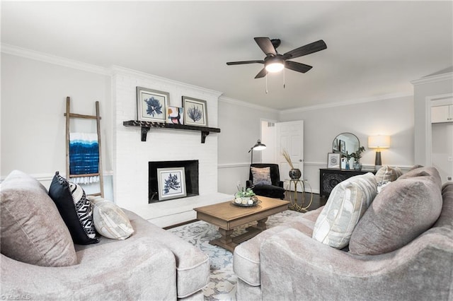 4105 Oak Hollow Dr, High Point, NC 27265 - living room with ornamental molding, ceiling fan, a fireplace, and wood finished floors