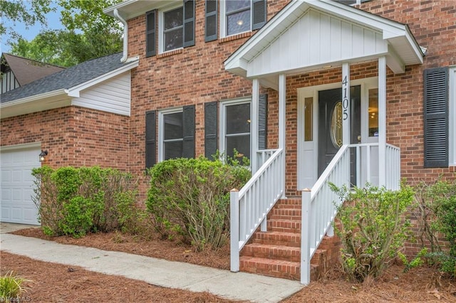 4105 Oak Hollow Dr, High Point, NC 27265 - entrance to property with an attached garage, brick siding, and a shingled roof