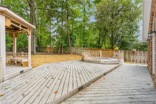 4105 Oak Hollow Dr, High Point, NC 27265 - wooden deck with a fenced backyard and view of wooded area
