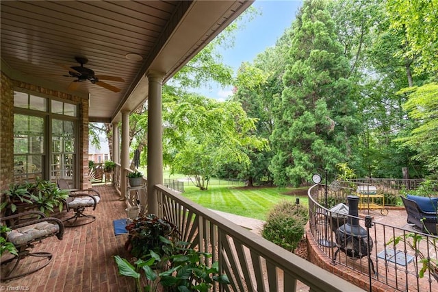 7672 Crossing Ridge Dr, Belews Creek, NC 27009 - wooden terrace featuring ceiling fan and a yard
