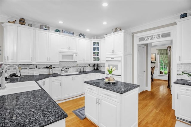 7672 Crossing Ridge Dr, Belews Creek, NC 27009 - kitchen with white appliances, tasteful backsplash, white cabinets, and recessed lighting
