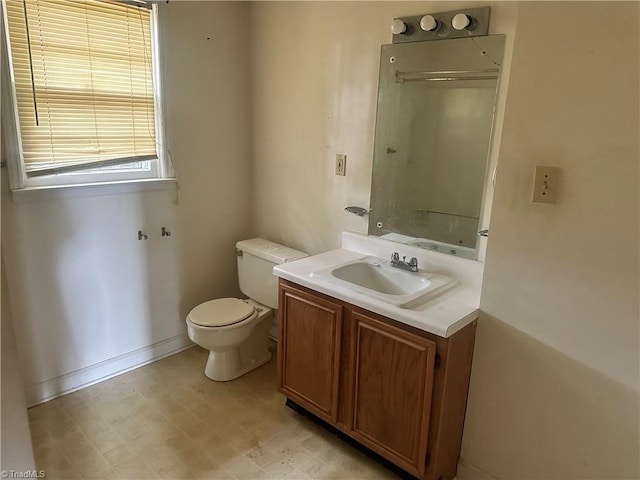 3815 Sheridan Rd, Greensboro, NC 27455 - bathroom featuring toilet, vanity, and baseboards