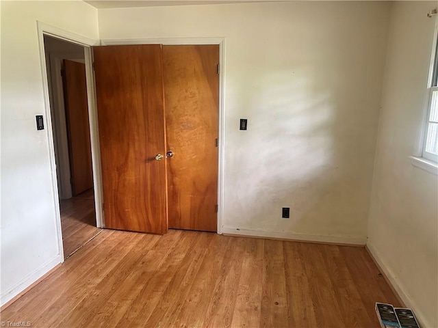 3815 Sheridan Rd, Greensboro, NC 27455 - unfurnished bedroom with light wood-type flooring and baseboards