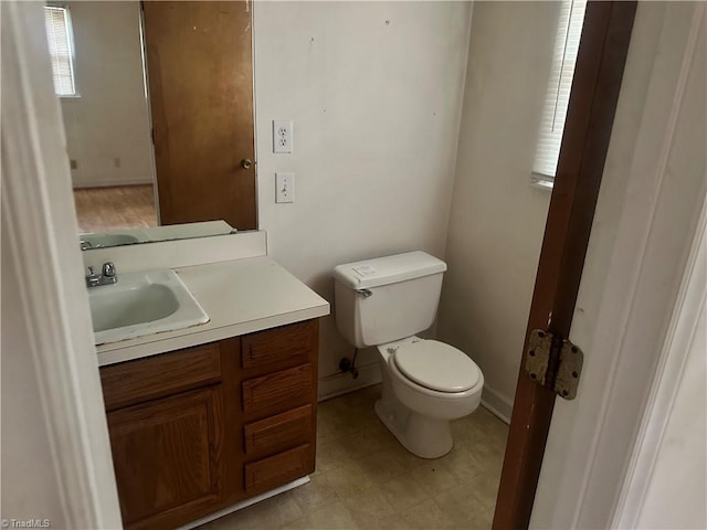 3815 Sheridan Rd, Greensboro, NC 27455 - bathroom with vanity, toilet, and baseboards