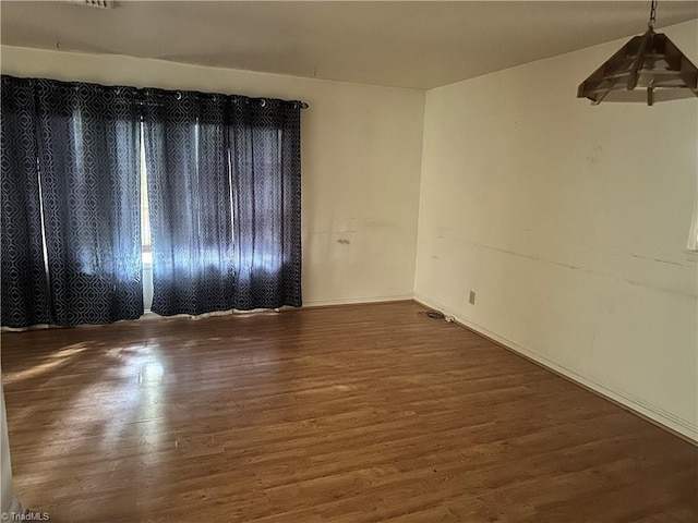 3815 Sheridan Rd, Greensboro, NC 27455 - unfurnished room with wood finished floors and baseboards