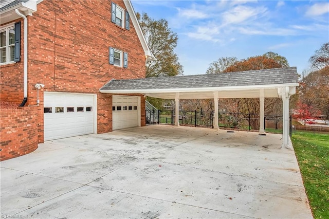 view of side of property featuring a carport and a garage