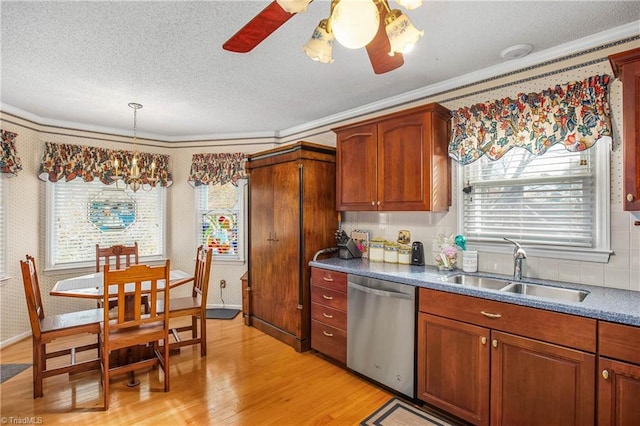 kitchen featuring dishwasher, light hardwood / wood-style flooring, ornamental molding, and sink