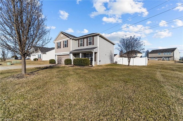 view of property featuring a garage and a front yard