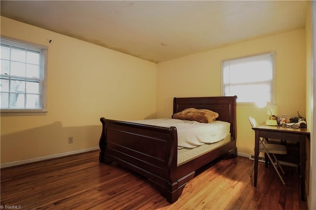 bedroom with hardwood / wood-style floors