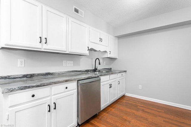 kitchen featuring dishwasher, sink, white cabinetry, a textured ceiling, and dark hardwood / wood-style flooring