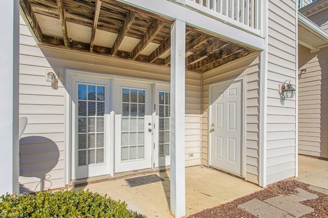 property entrance featuring french doors and a patio