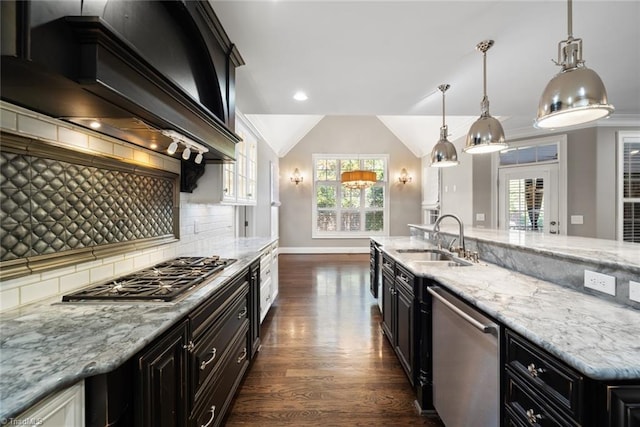 kitchen featuring premium range hood, pendant lighting, sink, dark hardwood / wood-style flooring, and stainless steel appliances