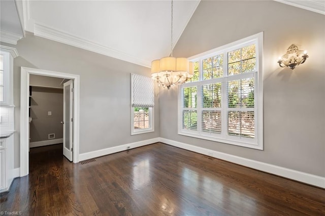 unfurnished dining area featuring dark hardwood / wood-style flooring, crown molding, vaulted ceiling, and an inviting chandelier