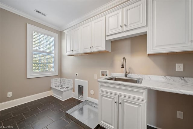 clothes washing area with sink, electric dryer hookup, cabinets, washer hookup, and ornamental molding