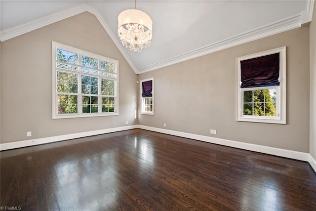 unfurnished room featuring crown molding, lofted ceiling, dark hardwood / wood-style floors, and an inviting chandelier