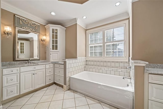 bathroom with vanity, ornamental molding, tile patterned floors, and a tub