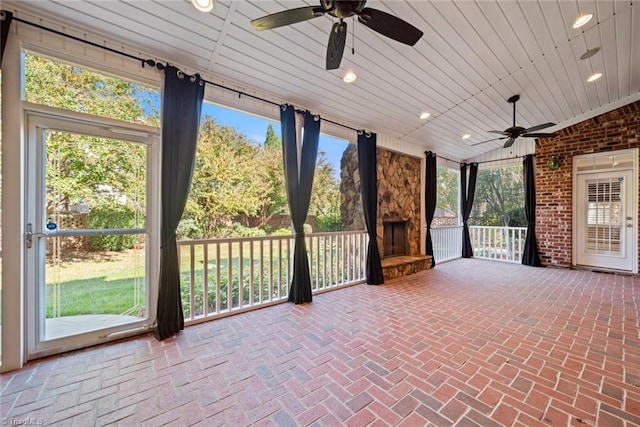 unfurnished sunroom with vaulted ceiling and wooden ceiling