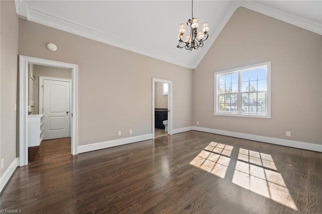 empty room with crown molding, high vaulted ceiling, dark hardwood / wood-style floors, and a chandelier