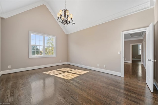 spare room featuring vaulted ceiling, plenty of natural light, ornamental molding, and dark hardwood / wood-style flooring