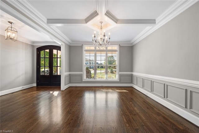 interior space with crown molding, dark hardwood / wood-style floors, french doors, and a chandelier