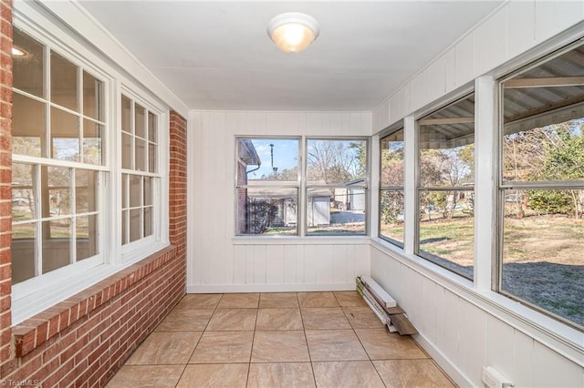 unfurnished sunroom with baseboard heating