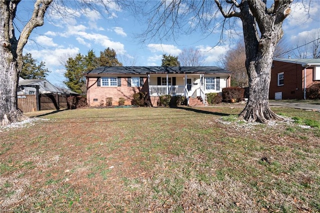 ranch-style house featuring a porch and a front lawn