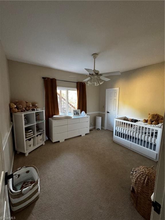 bedroom with a ceiling fan and carpet flooring