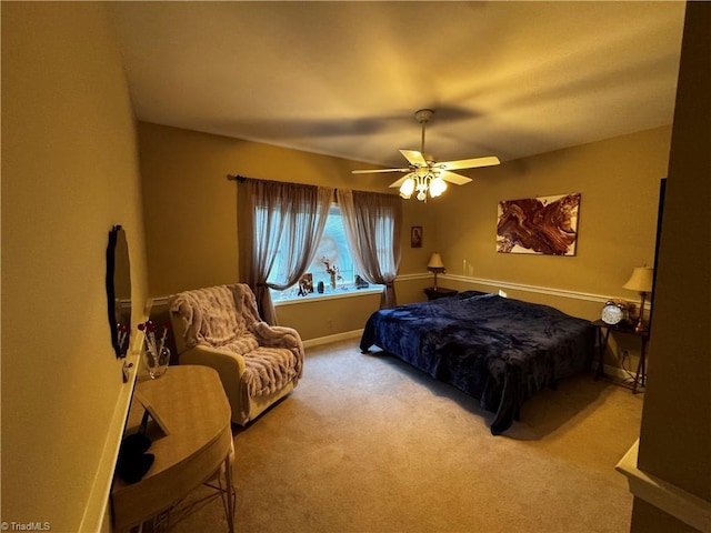 bedroom featuring ceiling fan and light carpet