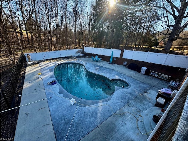 view of pool with a fenced backyard and a fenced in pool