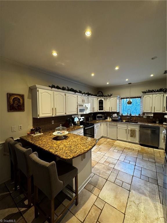 kitchen with electric stove, white cabinets, dark stone countertops, dishwasher, and a peninsula