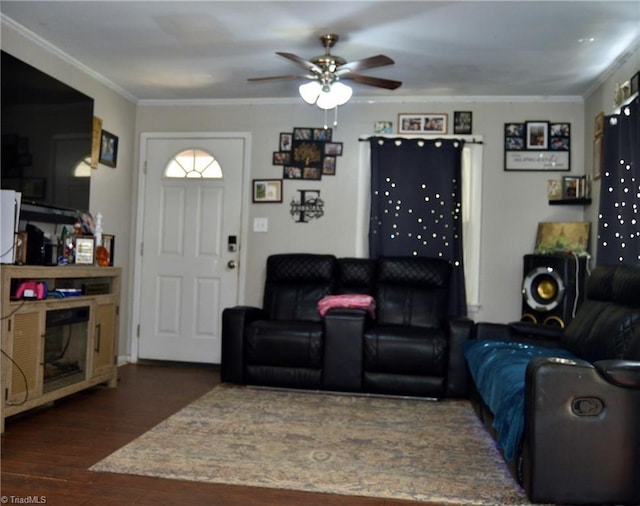living room with ceiling fan, wood finished floors, and ornamental molding
