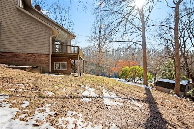 view of yard featuring a wooden deck