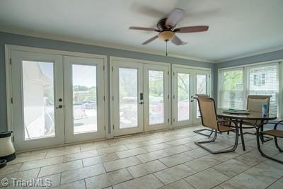 sunroom / solarium with ceiling fan, french doors, and plenty of natural light