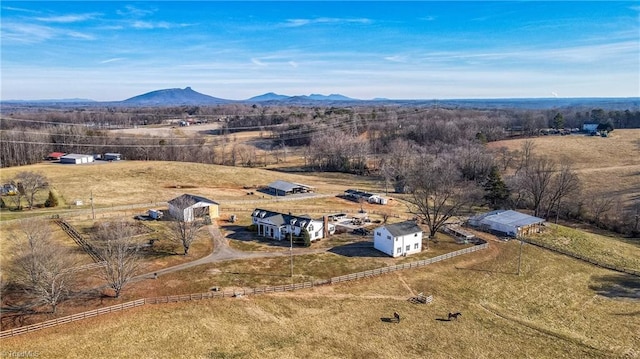 drone / aerial view featuring a mountain view and a rural view