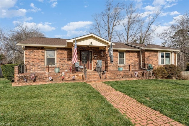 ranch-style house with brick siding, a porch, and a front yard