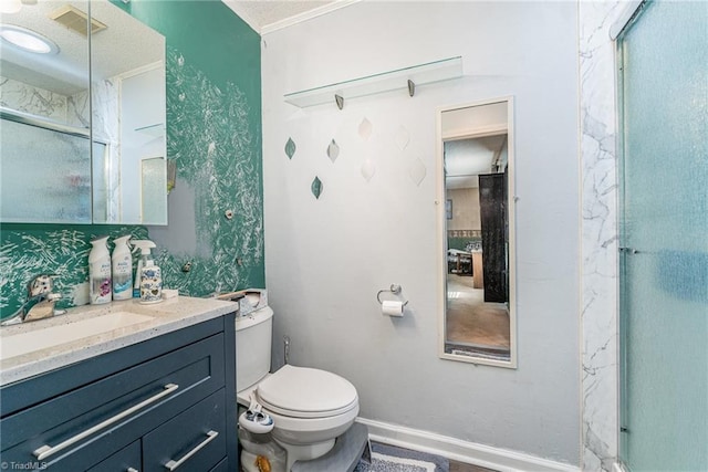 full bathroom with a shower with shower door, visible vents, toilet, baseboards, and vanity