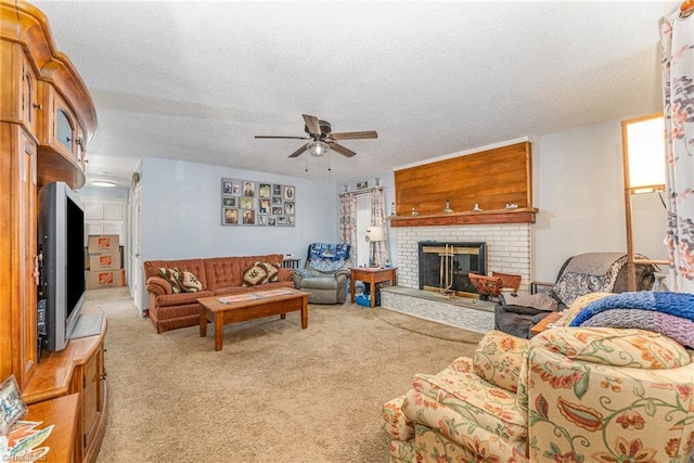 living area with light carpet, a brick fireplace, a textured ceiling, and a ceiling fan