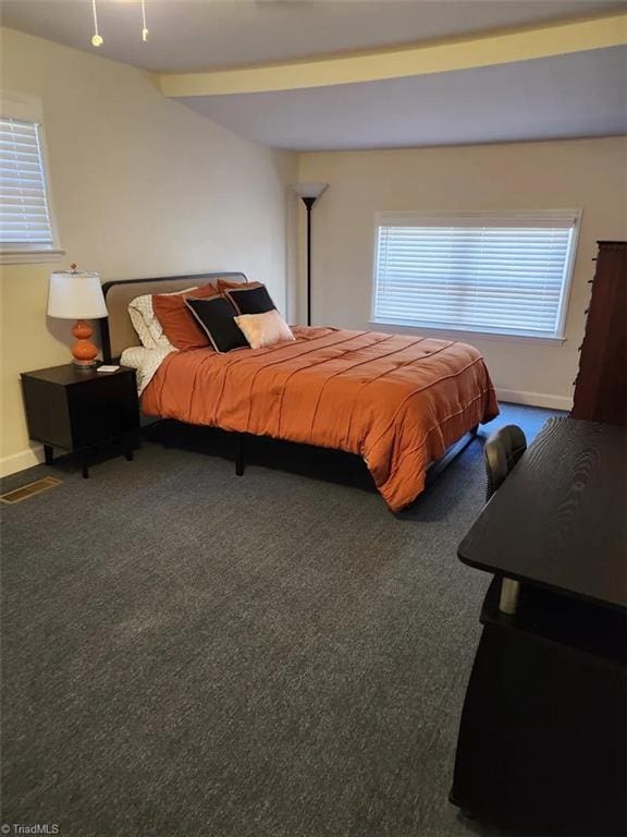 carpeted bedroom with baseboards