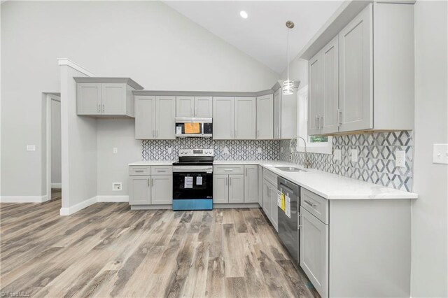 317 Styers Rd, Winston-Salem, NC 27105 - kitchen with a sink, light countertops, gray cabinets, light wood-style flooring, and stainless steel appliances