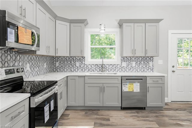 317 Styers Rd, Winston-Salem, NC 27105 - kitchen featuring hanging light fixtures, tasteful backsplash, light stone countertops, a sink, and stainless steel appliances