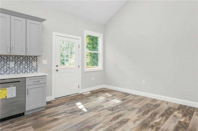 317 Styers Rd, Winston-Salem, NC 27105 - kitchen featuring gray cabinetry, lofted ceiling, light wood finished floors, and dishwasher